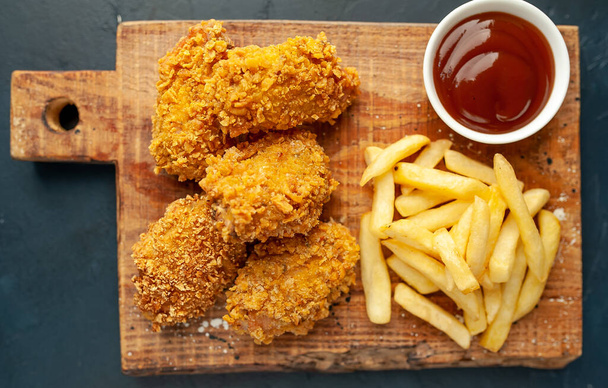 fried chicken on a black background - Photo, Image