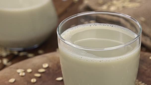 Portion of fresh Oat Milk (selective focus; close-up shot) - Πλάνα, βίντεο