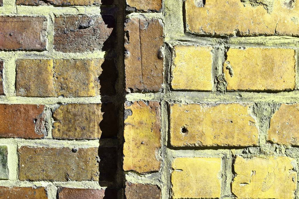 Beautiful aged and weathered yellow bricks walls found all over europe in high resolution - Fotó, kép