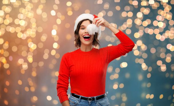 happy young woman in santa hat on christmas - Фото, зображення