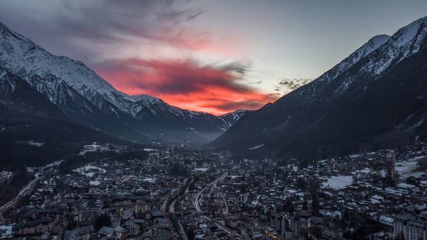 Aerial drone view of red evening glow over Chamonix Mont Blanc, in French Alps - Photo, Image