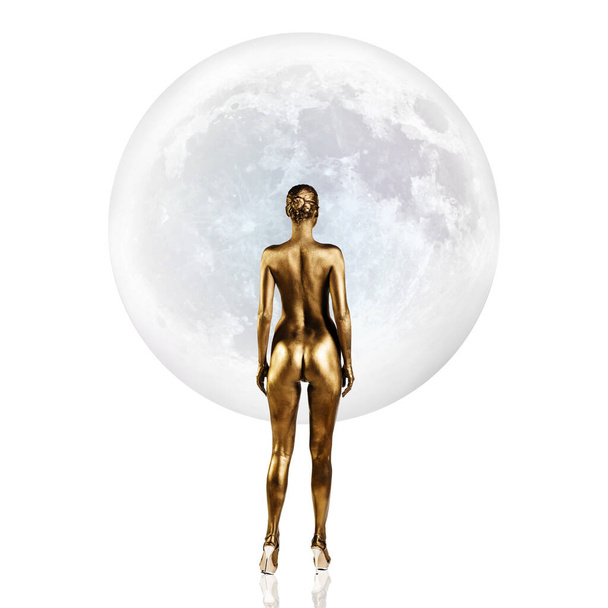 Golden woman standing in front of the full moon. - Foto, afbeelding
