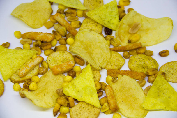 beer mix, crackers, chips, nuts, peanuts, salted corn on a white background - Photo, Image