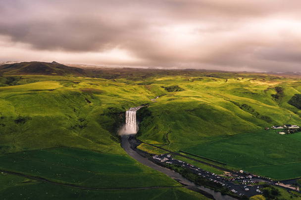 Aerial view of the Skogafoss waterfall in southern Iceland at sunset - Photo, Image