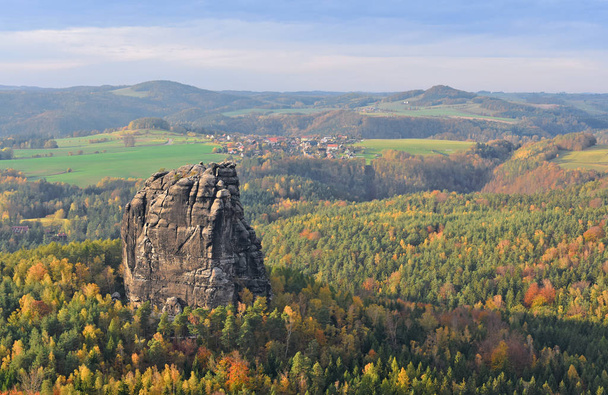 Autumn in Saxon Switzerland with bright forest colors and rocks. - 写真・画像