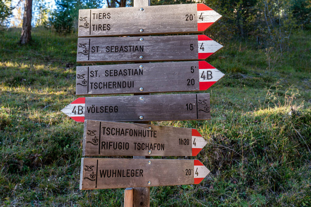 Wooden signpost showing the direction of different hiking paths  - Fotoğraf, Görsel