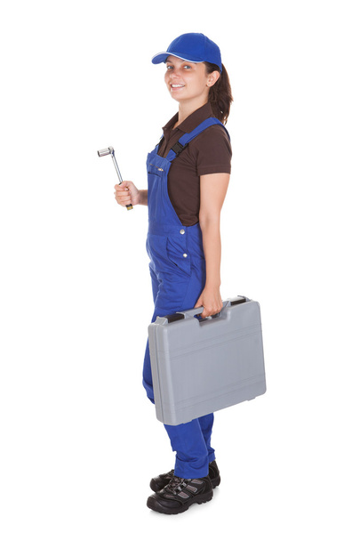 Female technician holding toolkit - 写真・画像