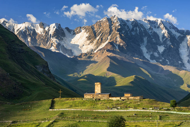 Incredible views of the Caucasus Mountains, Georgia's highest summit - Shkar and Lamaria Monastery, Ushguli, Georgia, Caucasus, Svaneti - Valokuva, kuva