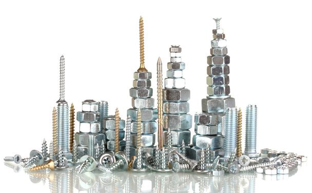 Many types of metal bolts, screws and nuts isolated on white - 写真・画像