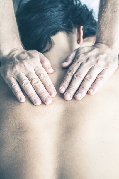 Close up of therapist doing  massage on woman - Foto, Bild
