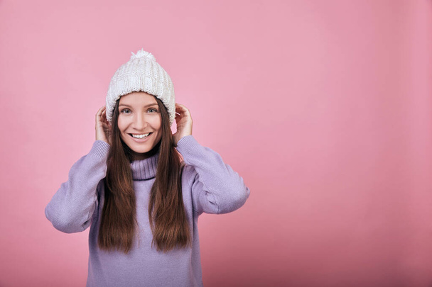 A kind sweet, charming girl in comfortable warm clothes - Fotoğraf, Görsel