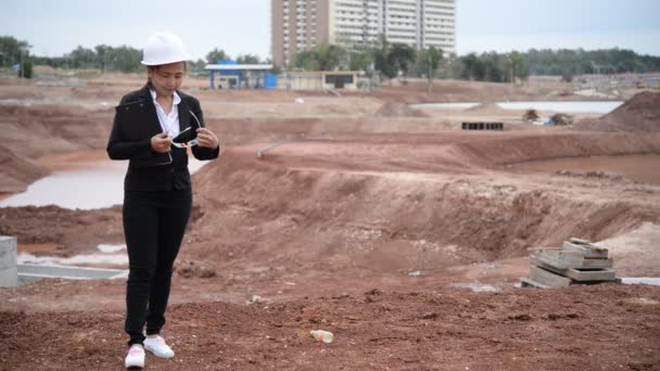 Engineer woman working at building project site  - Video