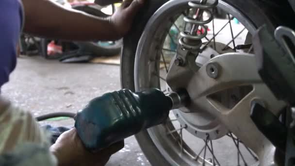 close up of man repairing motorcycle  - Filmati, video