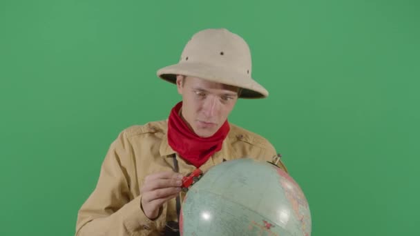 Adult Man Explorer Moving A Car On A Globe - Кадри, відео
