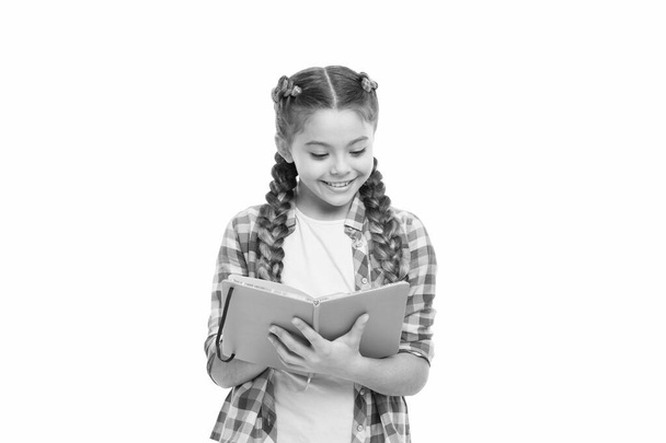 Interesting story. Achieve knowledge. Education concept. Cute small child holding book. Adorable little girl with school exercise book. Preparing activity book writing. Reading skills. Study language - Photo, Image