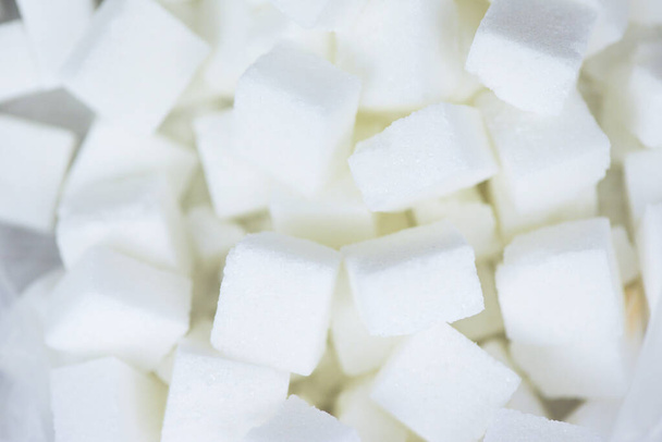 Primer plano de azúcar blanca, vista superior / Textura de los cubos de azúcar backgro
 - Foto, Imagen