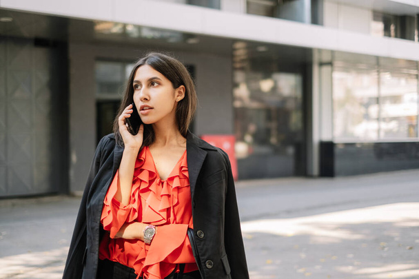 Elegant businesswoman having phone call conversation outside - Φωτογραφία, εικόνα