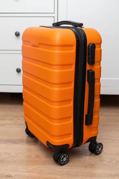 Orange travel suitcase - Φωτογραφία, εικόνα