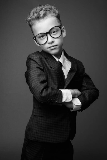 Young boy as businessman wearing suit in black and white - Photo, Image