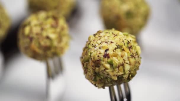 Closeup of delicious canape balls put on silver forks on table for catering - Footage, Video
