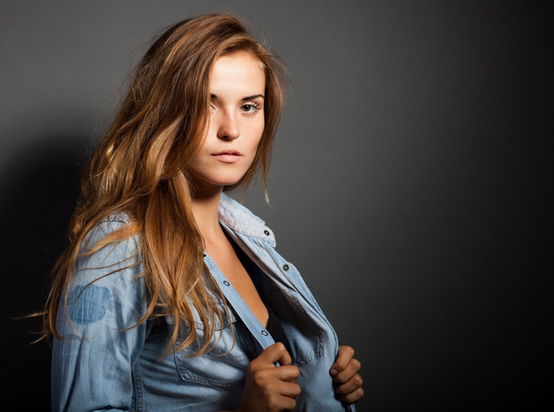 Portrait of natural woman in denim jeans shirt - Photo, image