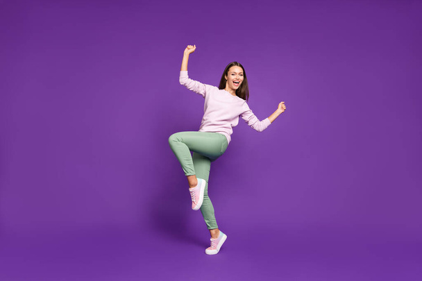 Full length body size turned photo of sweet charming cute girlfriend excited about having won ticket to local discotheque rejoicing isolated over purple vivid color background - Valokuva, kuva