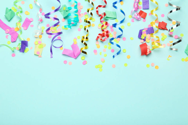 Colorful ribbons with confetti on blue background - Fotografie, Obrázek