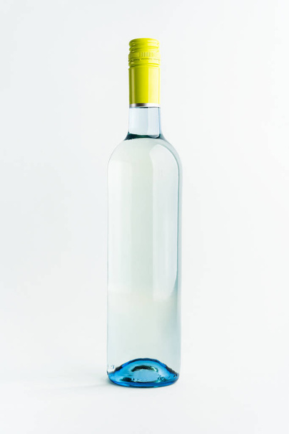A bottle of white wine for the label layout on a light background. alcoholic beverage. branding - Foto, immagini