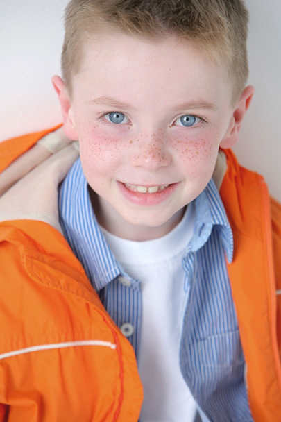 Young Boy With Freckles Smiling At Camera - Foto, imagen