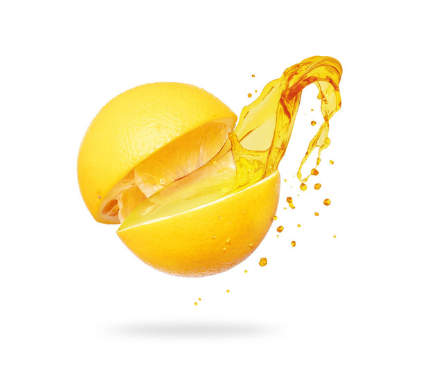 Juice splashes out of a cut orange on a white background - Foto, immagini