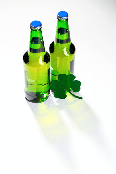 Two buttle of green beer on white background. Concept for St. Patrick's day. - 写真・画像