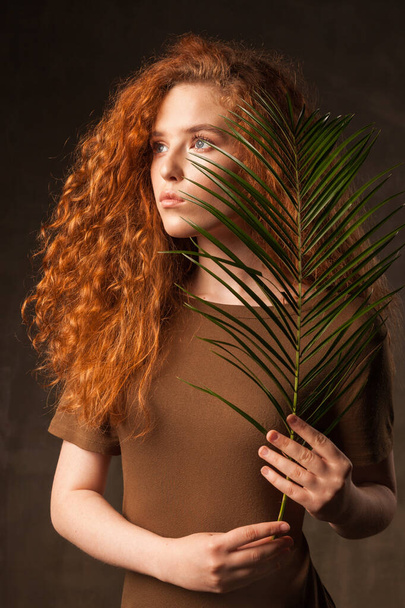 Energizer beautiful young curly ginger hair woman. - Φωτογραφία, εικόνα