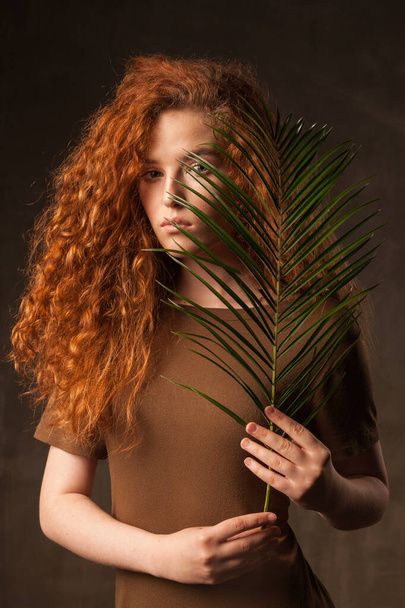 Energizer beautiful young curly ginger hair woman. - Foto, Imagen