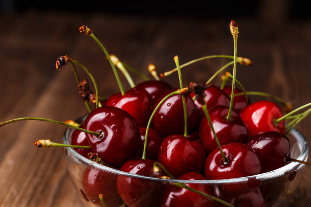 Bowl with fresh red Cherries. Healthy food concept - Фото, зображення