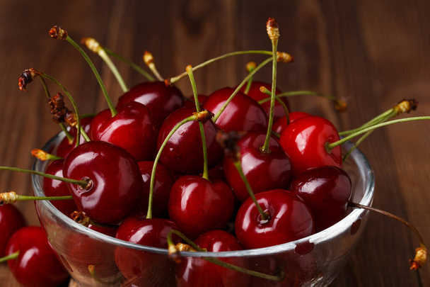 Bowl with fresh red Cherries. Healthy food concept - Photo, Image