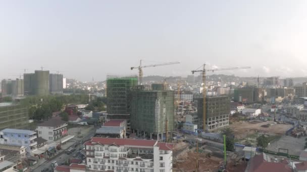 Construction Crane and building process in Cambodia Sihanoukville city - Πλάνα, βίντεο