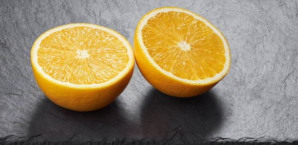 Orange fruit on a stone desk - Foto, Imagen
