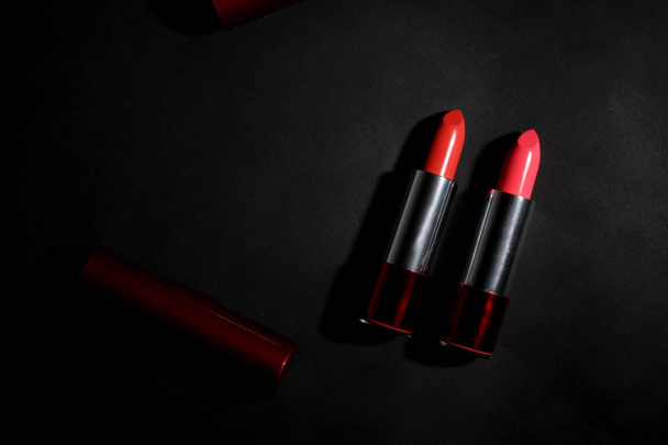 Lipstick. Fashion Colorful Lipsticks over black background. Lipstick tints palette, Professional Makeup and Beauty. Beautiful Make-up concept. Lipgloss. Lipsticks closeup - Φωτογραφία, εικόνα