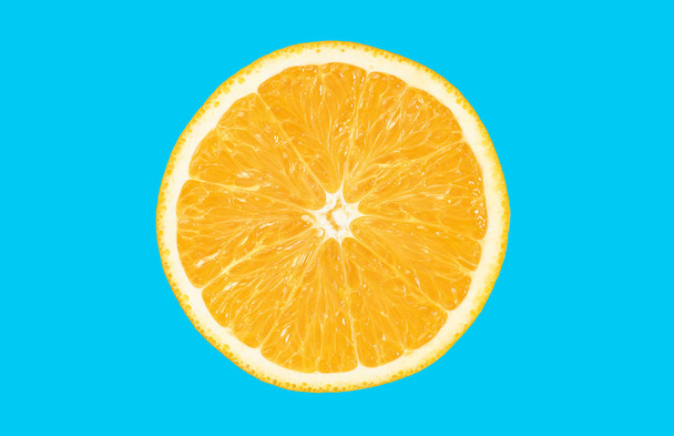Fresh orange fruit isolated on blue background - Фото, изображение