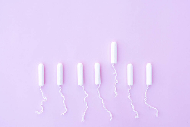 Female tampons for menstruation on a pink background. - Photo, Image