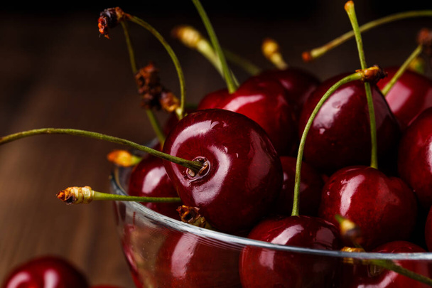 Bowl with fresh red Cherries. Healthy food concept - Foto, afbeelding