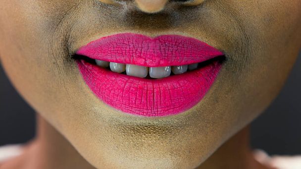 Close up of a beautiful black woman lips and face - 写真・画像
