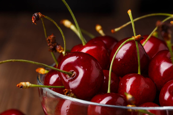 Bowl with fresh red Cherries. Healthy food concept - Fotó, kép