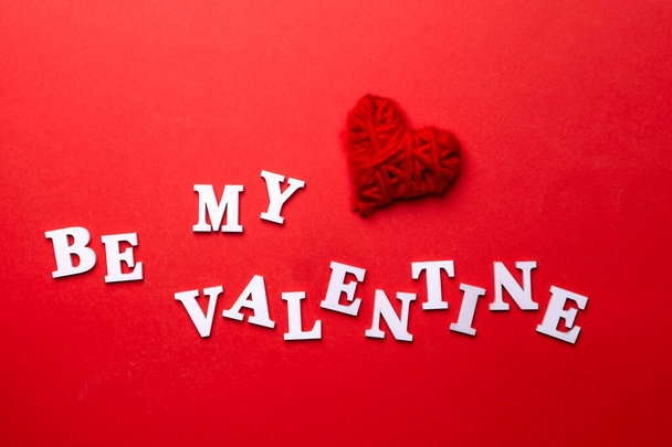 Be my Valentine. The inscription of white letters on red background. - Photo, Image