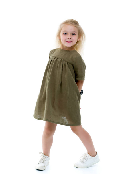 Cute little girl in a light summer dress. - Fotó, kép