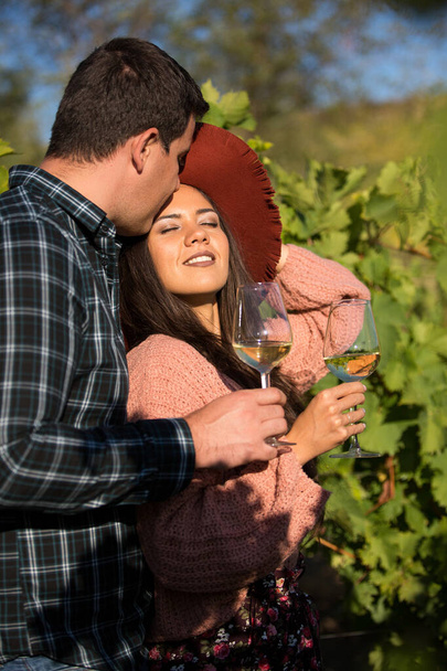 Happy young wife with a stylish hat a in vineyard on the country side - Fotografie, Obrázek