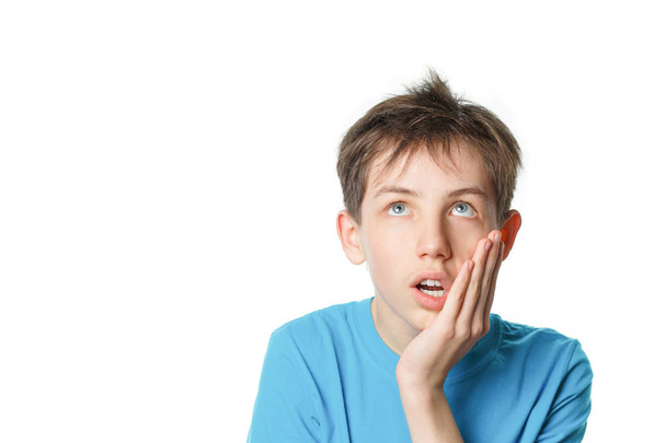 surprised boy holding his head isolated on white background - Foto, Imagem