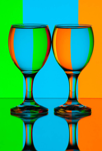 Two glasses of water in front of stripes refraction. Still life - Photo, Image