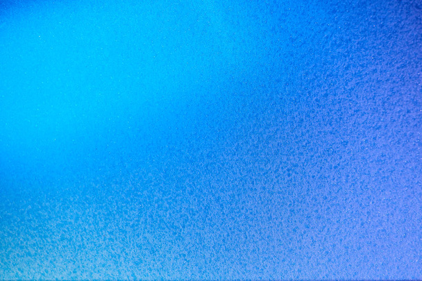 Textueller Hintergrund blauer Farbe mit teilweiser Unschärfe - Foto, Bild