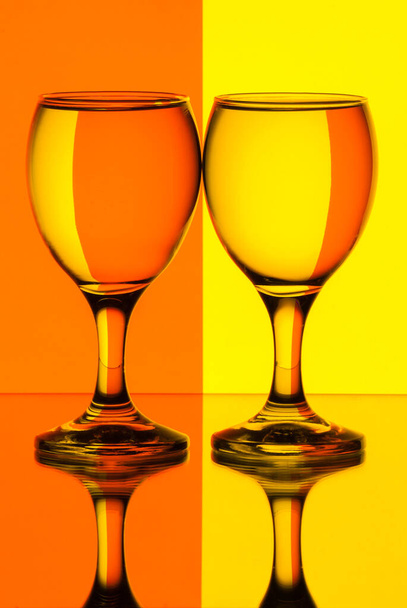 Two glasses of water in front of stripes refraction. Still life - Photo, Image